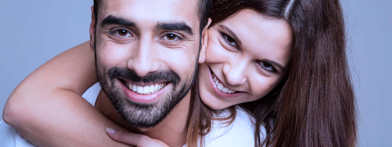 couple happy together after dental crowns and veneers appointment